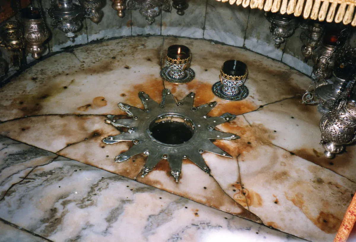 Silver star in the Grotto of the Nativity in Bethlehem, a day trip from the Old City of Jerusalem