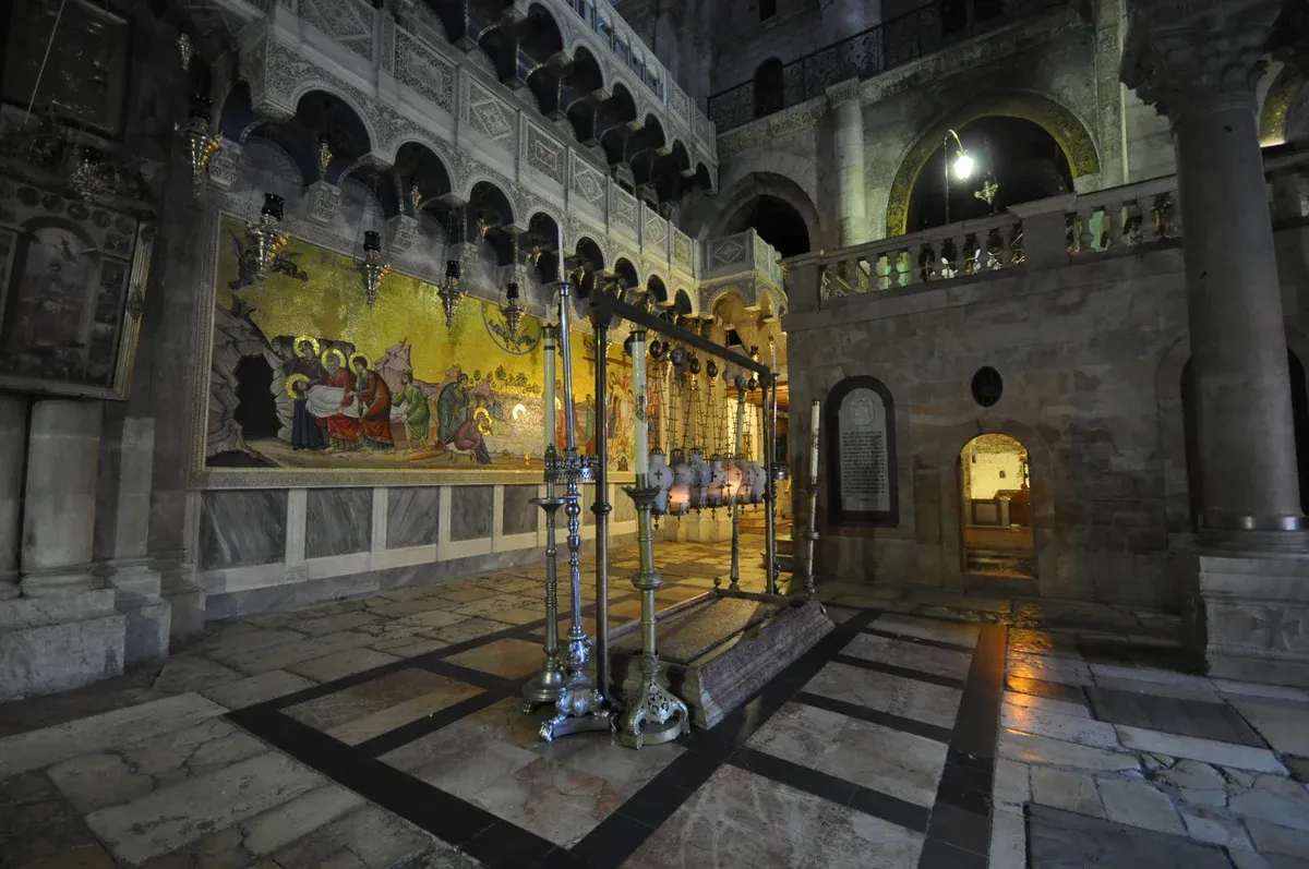 Stone of Anointing and mosaic inside the Church of the Holy Sepulchre in the Old City of Jerusalem
