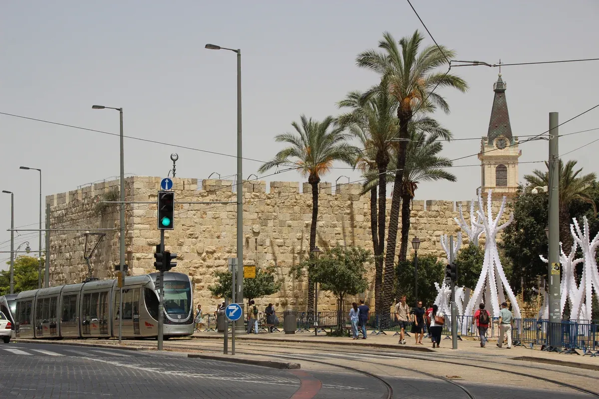 Light rail tram beside the walls of the Old City of Jerusalem